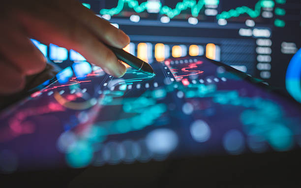 professional hand analyzing price charts with stylus on a digital tablet, surrounded by colorful trading data. strong themes of financial planning, AI-driven investment strategies