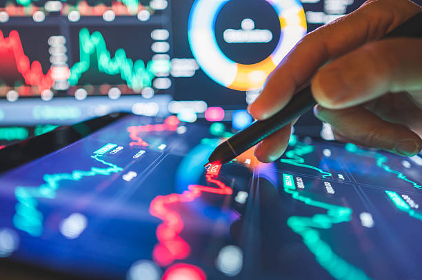 istock Investor decision-making under pressure with volatile charts and interactive sell red sell button on digital trading screen surrounded by real-time 2209325708