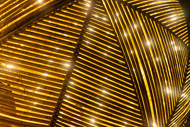 Bamboo texture glows with warm lights creating rustic background and artistic charm, Wooden slats weave pattern under evening illumination radiating natural beauty and ambiance
