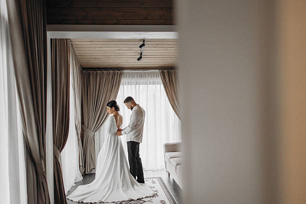 istock A bride and groom are getting ready for their wedding 2209330503