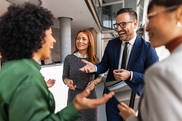 istock Professional Team Engaged in Lively Office Discussion with Smiles 2209334145