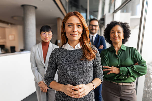 istock Confident Business Team Standing Together in Modern Office 2209334191
