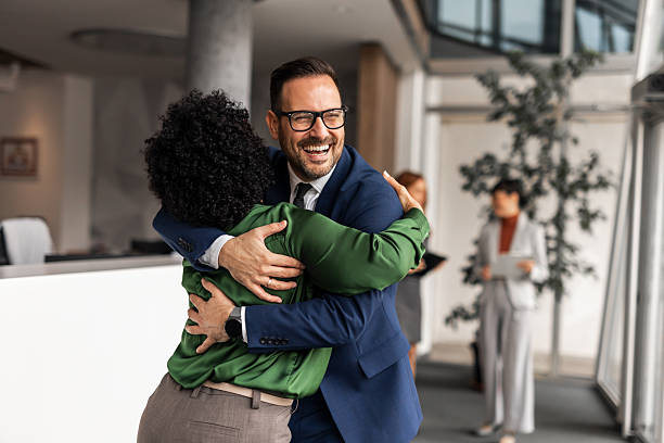 istock Business Professionals Sharing Warm Greeting in Modern Office Environment 2209335056