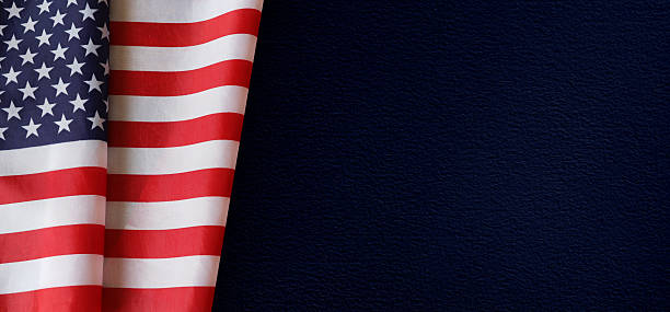 istock American Flag on Dark Blue Background – Patriotic Concept 2209335920