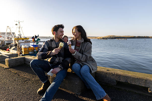 istock Enjoying Ice Cream By The Sea 2209335959