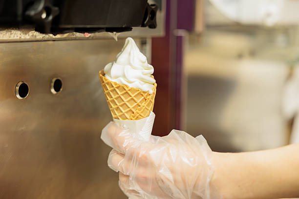istock Ice cream from the vending machine in a waffle glass. 2209336267