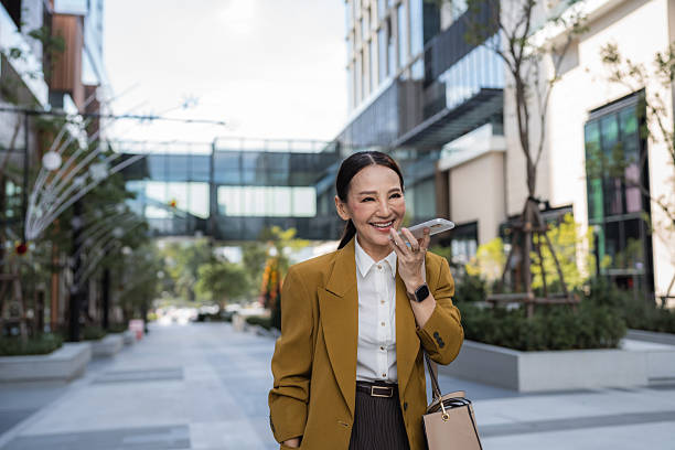 istock Confident senior business woman talking on a call cheerfully while walking in heels 2209336424