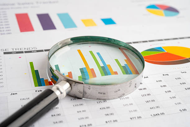 istock Magnifying glass on charts graphs paper. Financial development, Banking Account, Statistic, Investment Analytic research data economy. 2209336443