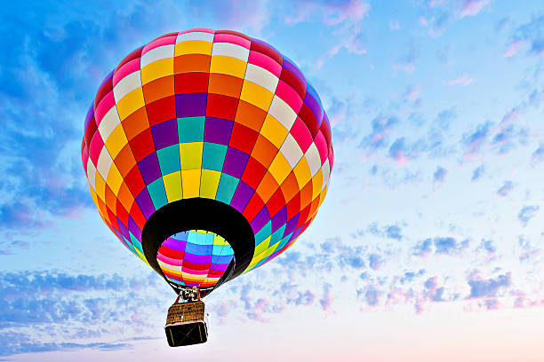 istock Hot air balloon flight over blue sky 2209344237