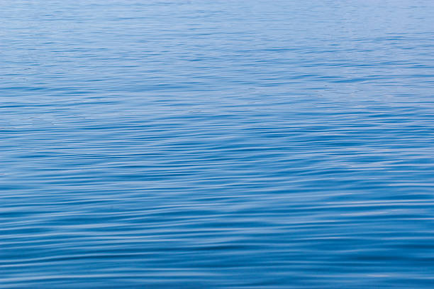 istock close-up of rippling blue water surface.. 2209344292