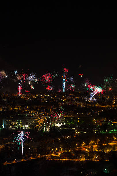 fireworks display over city skyline at night.