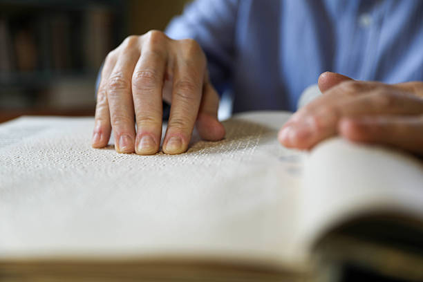 istock A Blind Man Over 50 Reading Braille Book 2209346433