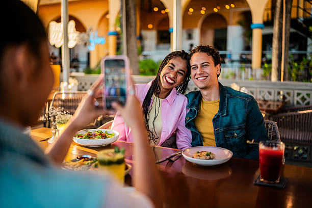 istock Young couple posing to photo at restaurant 2209346528