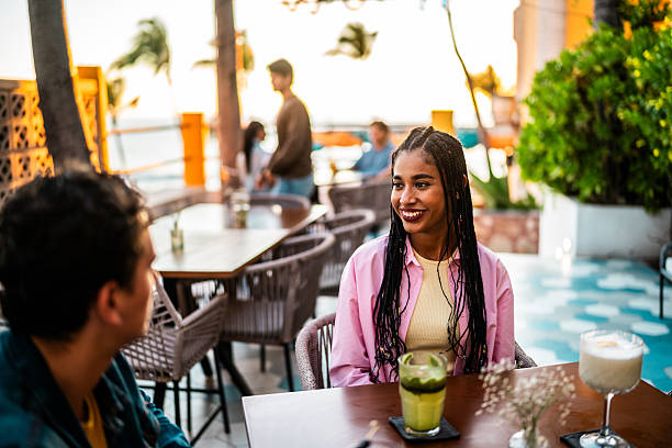 istock Young couple talking at restaurant 2209346722