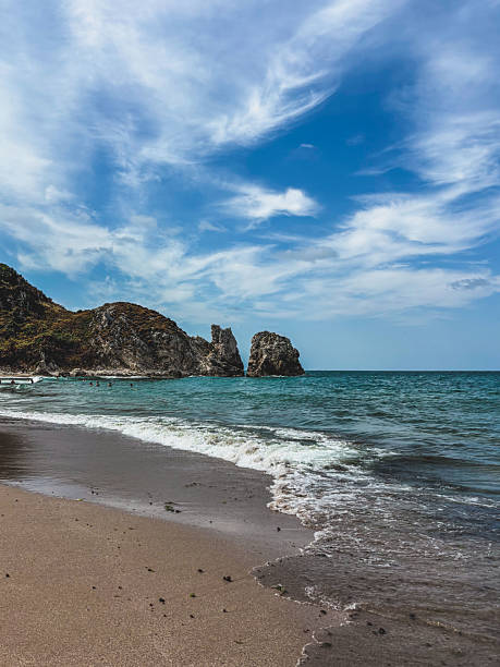 istock Sunny beach with soft sand, rugged cliffs, and emerald sea waves under a bright blue sky, ideal for relaxation. Sile Istanbul, Turkey. Black Sea 2209349069
