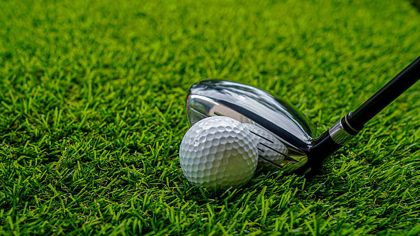 istock Golf ball and golf club in beautiful golf course at sunset background. 2209349713