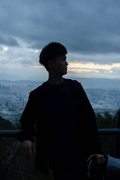 istock The young man standing on the mountaintop 2209350741