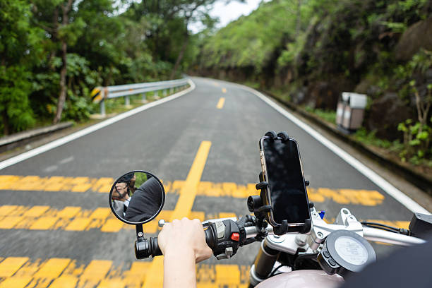 Riding a motorcycle and using mobile navigation on a winding mountain road