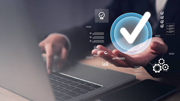 istock Approval Control and Certification, Businessman hold digital Checklist for Business Process Compliance and  Quality verification and management high standards and efficiency. 2209356199