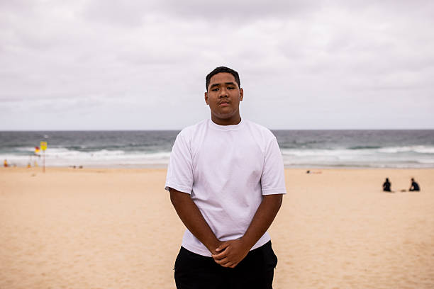 istock Teenager Standing on the Beach 2209360451