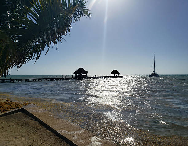 Landscape - Pier and Sailboat in the Caribbean Islands. Tropical Vacation