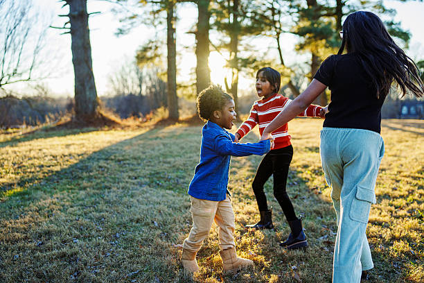 istock Girls having fun playing outside 2209364571