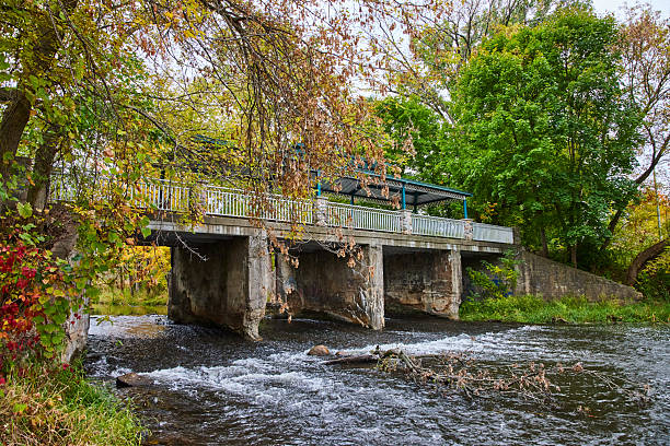 istock Autumnal Footbridge with Shelter Over Tranquil River 2209366590
