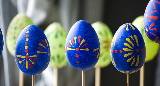 istock Brightly painted Easter eggs on display, showcasing intricate patterns and vibrant colors. 2209370740