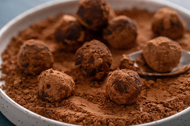 istock Dark chocolate ganache truffles tossed with cocoa 2209371298