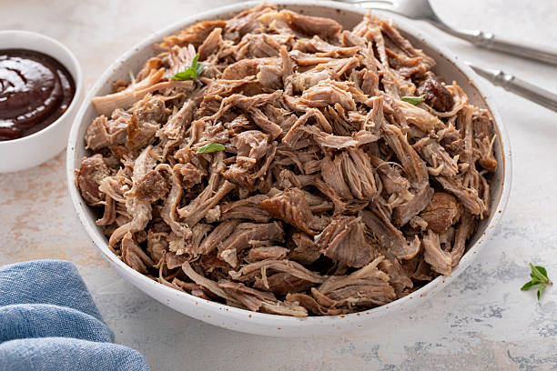istock Pulled pork or carnitas cooked in a slow cooker served in a bowl to make sandwiches 2209371332