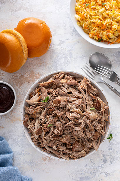 istock Pulled pork or carnitas cooked in a slow cooker served in a bowl to make sandwiches 2209371353