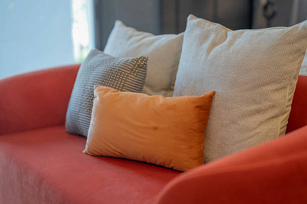 istock Pillows on a couch in the living room Empty Couch With Cushions  with light from window house beautiful concept 2209371978