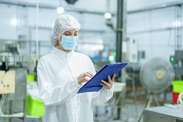 istock Quality control officer is randomly inspecting a raw materials in canned fish production facility. 2209375163