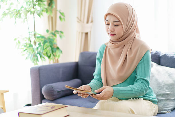 istock Asian muslim woman praying for Allah. 2209375508