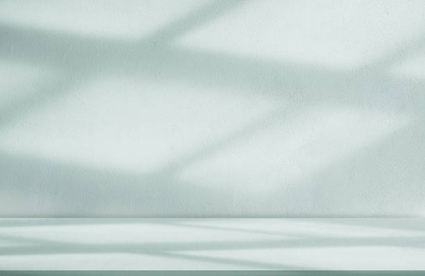 istock Light Green Background,Light and Shadow on Wall Texture,Studio background with podium for spring product,Summer backdrop light blue concrete wall with shadow from window reflection on cement floor 2209379051