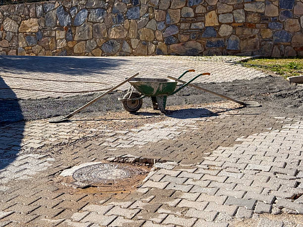 Blocking road with Construction metal trolley on a rubber wheel and two shovels