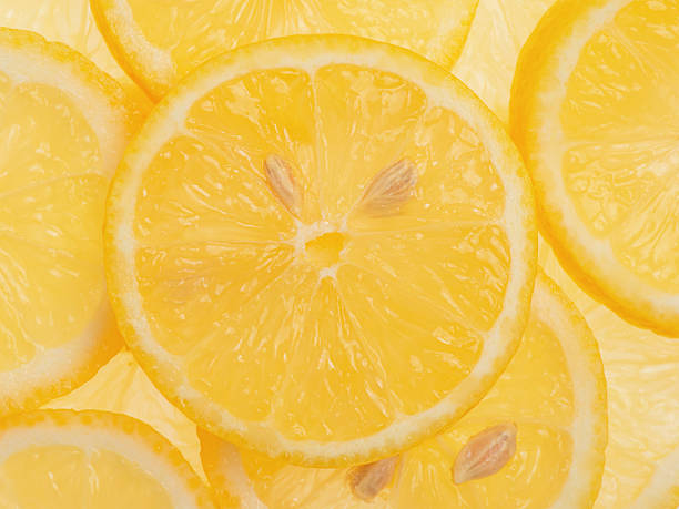istock Lemon slices as a background macro photography. Citrus fruit, lemon. 2209383115