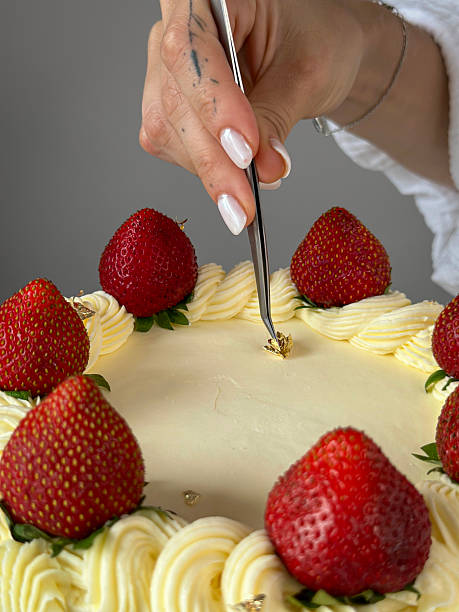 istock Gold Leaf Decoration on Strawberry-Topped Cake 2209383212