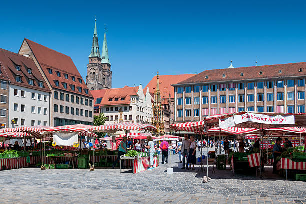 NUREMBERG, GERMANY - JUNE 13, 2019: Market stalls on the market square of the Franconian city of Nuremberg in Germany.
