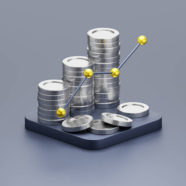 istock Stacks of Silver Coins with Graph Symbols Displaying Financial Growth 2209384845