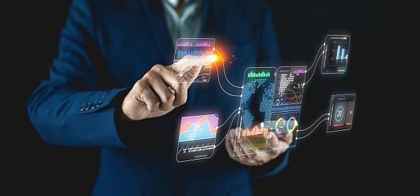 istock A professional in a suit interacts with futuristic digital interfaces displaying data and analytics, showcasing technology and innovation. 2209384974