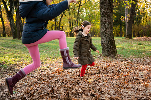 istock Children jumping on autumn leaves 2209386837