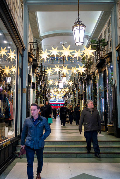 Piccadilly Arcade, between Piccadilly and Jermyn Street in London’s Mayfair district, decorated for Christmas. The arcade contains 28 prestigious shops and was opened in 1909.