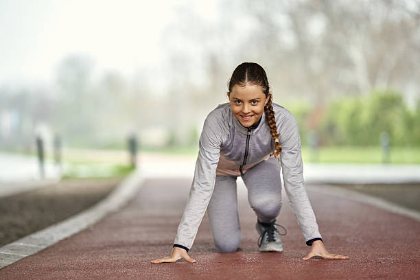 istock Girl is preparing to run in the park 2209391446