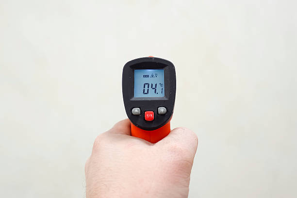istock Temperature measurement with laser thermometer. Laser technology 2209392568