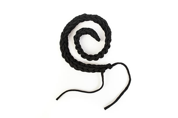 Crochet rope chain arranged in a spiral shape on white background