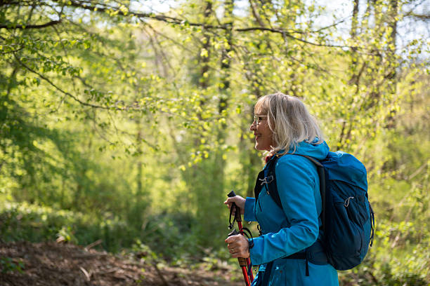 istock Senior woman enjoying the forest hike 2209394903