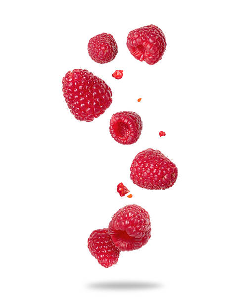 istock Ripe raspberries floating in the air close-up on a white background 2209396058