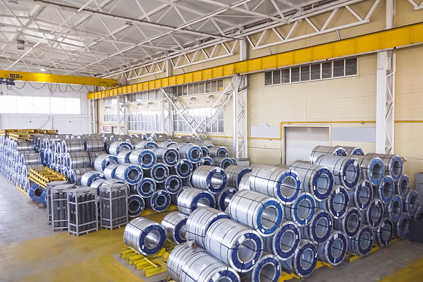 istock Sheet metal coils in storage warehouse. 2209399879