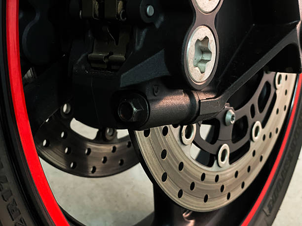 istock Sport Motorcycle Front Wheel with Brake Disc Close-Up 2209400055